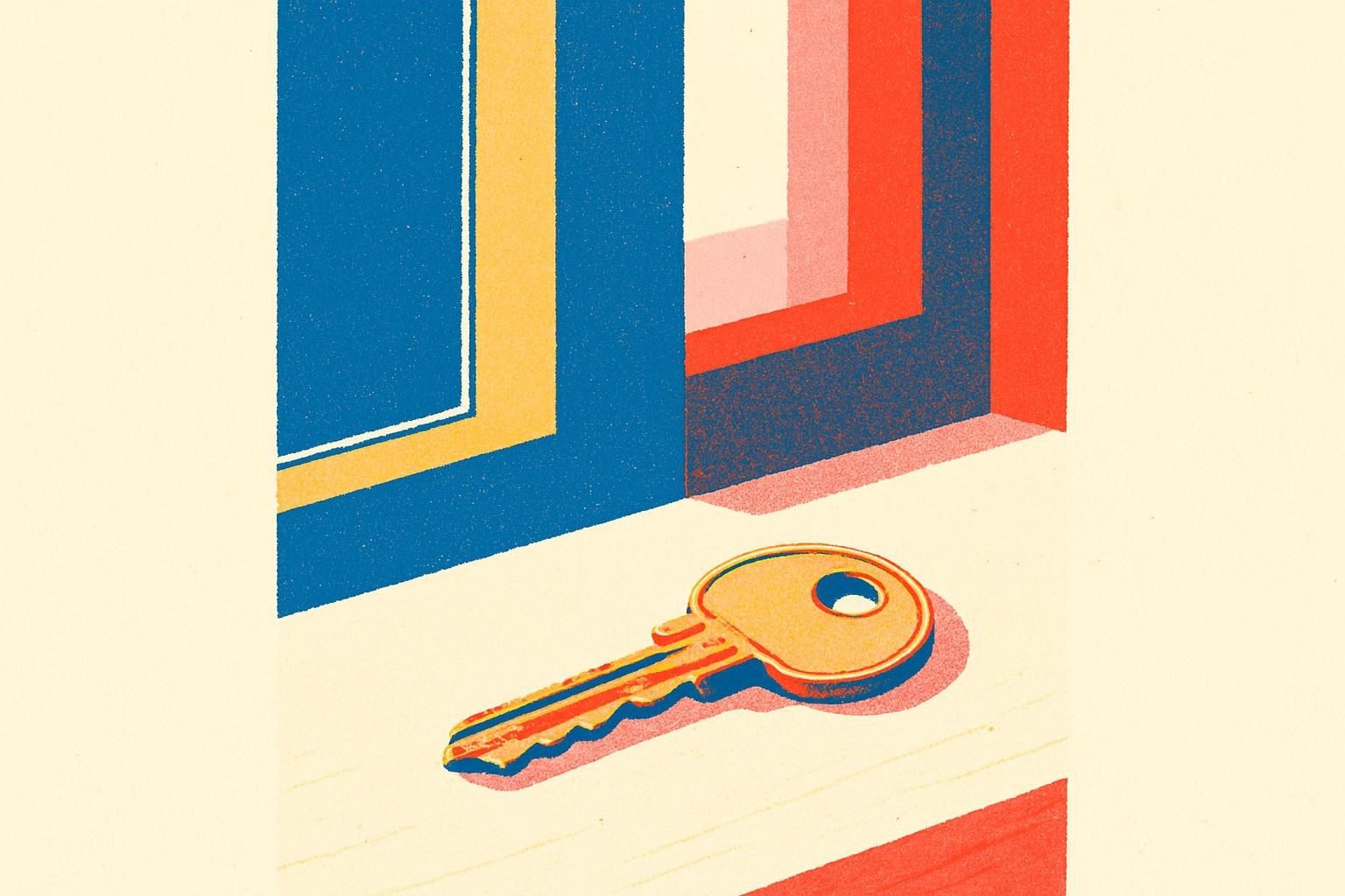 A single old key lying on a plain wooden table in soft afternoon light.